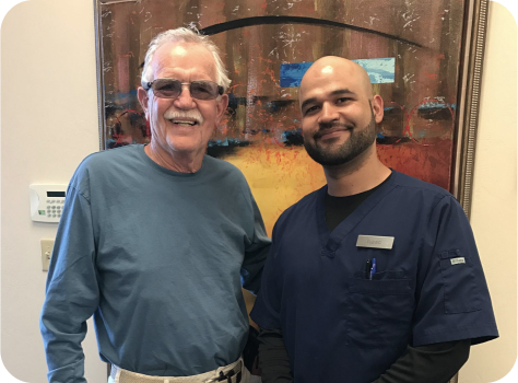 A team member smiling with a patient